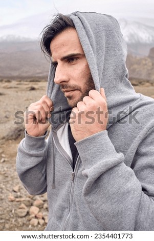 Similar – Image, Stock Photo Serious man admiring mountain in nature