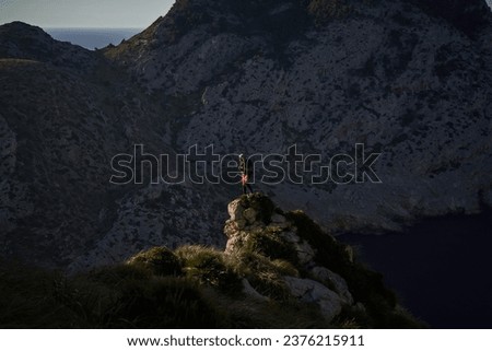 Similar – Image, Stock Photo Unrecognizable hiker observing wild valley from rocky cliff