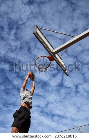 Similar – Image, Stock Photo Anonymous sportsman jumping on trial bike during workout