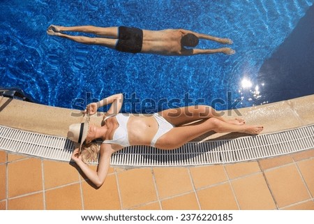 Similar – Image, Stock Photo Anonymous woman sunbathing on rocky beach