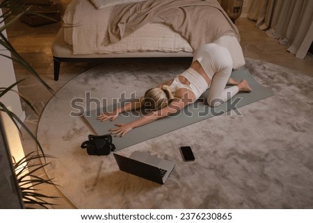 Similar – Image, Stock Photo Anonymous woman stretching body in seated forward bend position