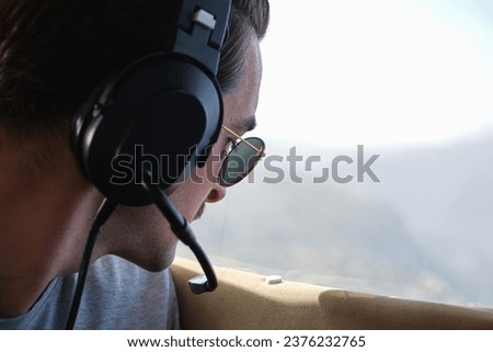 Similar – Image, Stock Photo Serious man admiring mountain in nature