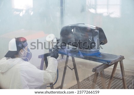 Similar – Image, Stock Photo Busy technician in motorcycle workshop