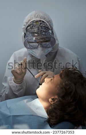 Image, Stock Photo Anonymous dentist checking teeth of patient