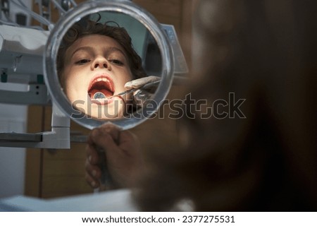 Similar – Image, Stock Photo Anonymous dentist checking teeth of patient