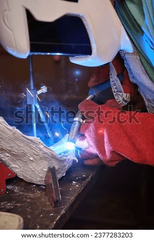 Similar – Image, Stock Photo Unrecognizable handyman using machine on factory