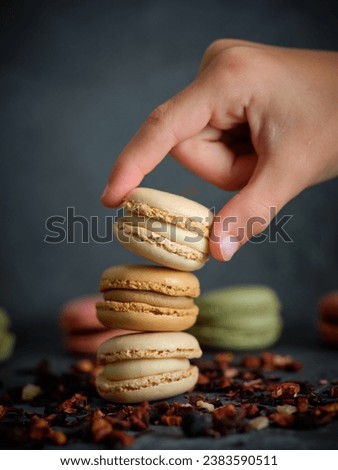 Image, Stock Photo Crop hand placing macaroons on the table