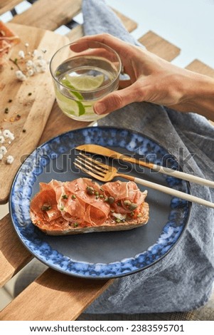 Similar – Image, Stock Photo Anonymous person eating toast with eggs and cheese