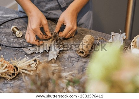 Similar – Image, Stock Photo Unrecognizable female professional florist making bouquets.