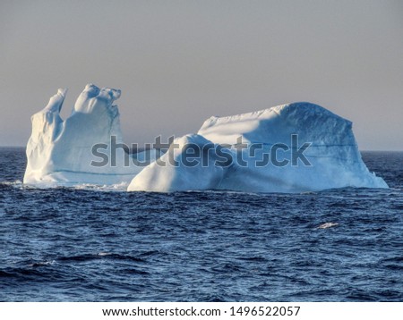 An iceberg is a piece of ice that has become detached from its parent glacier by a process known as calving. In Canada, icebergs mainly originate from west Greenland glaciers and travel south along 