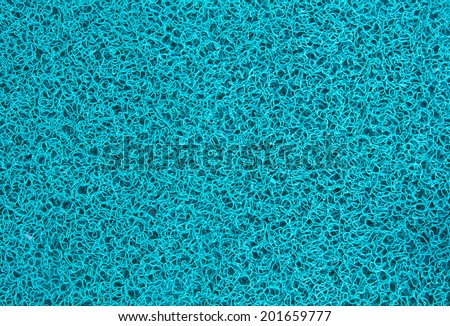 Background of turquoise carpet or foot scraper or door mat texture
