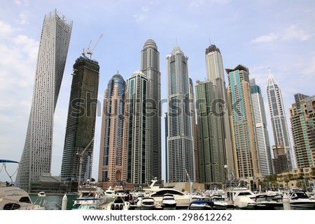 DUBAI, UAE - MARCH 23 - 2015 : Modern buildings in Dubai Marina, Dubai, UAE. In the city of artificial channel length of 3 kilometers along the Persian Gulf, taken on 23 March 2015 in Dubai.