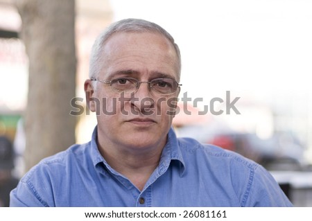 Close-up portrait of a sad senior man, shallow depth of field