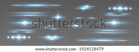 Blue horizontal lens flares pack. Laser beams, horizontal light rays.Beautiful light flares. Glowing streaks on dark background. Luminous abstract sparkling lined background.