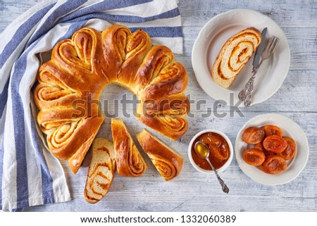 Similar – Image, Stock Photo Apricot pie with one sliced piece. Top view of a lattice crust pie