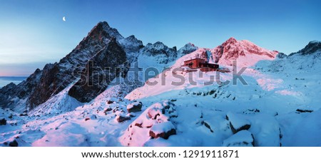 View of the Teryho Cottage (Teryho chata, Schronisko Teryego) at sunrise with pink colored mountain peaks and Small Cold Valley, Vysoke Tatry (High Tatras mountains), Stary Smokovec, Slovakia  Stok fotoğraf © 