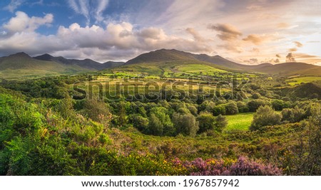 Large panorama with beautiful sunset, dramatic sky at the foothill of Carrauntoohil mountain, MacGillycuddys Reeks mountains, Ring of Kerry, Ireland Stok fotoğraf © 