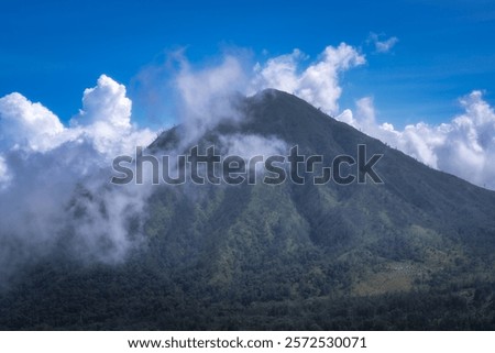 Similar – Foto Bild Schroffer Berggipfel eingehüllt in dunkle Wolken