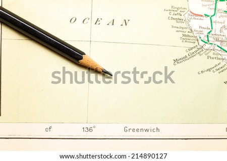 Old  and vintage paper map  with pencil putting on it represent the detail of city name and destination.