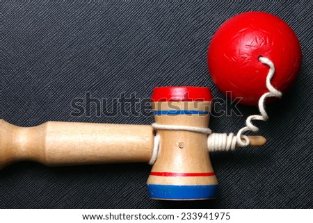 Kendama traditional Japanese toy represent the toy game performed by juggling the ball between the cups balancing it in various positions.