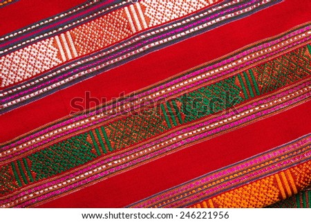 Traditional northern and northeastern Thai style handmade fabric weave  by interweave process represent the textile surface texture background.