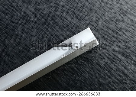 Aluminum bar straight type in the scene appear screw nuts also use as a interior ceiling construction material represent the home improvement equipment.