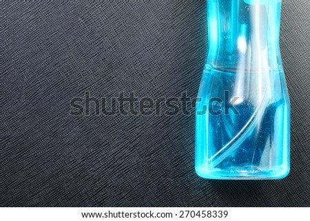 The window cleaning fluid in the clear bottle represent the cleaning concept related idea.