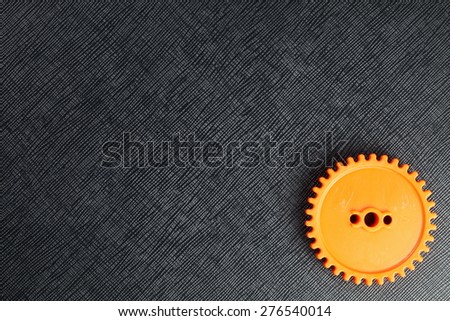 The orange plastic gear represent the mechanism concept related idea.
