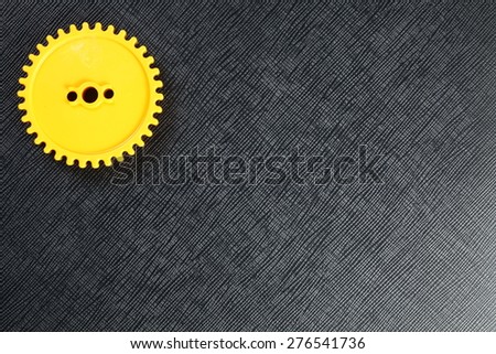 The yellow color plastic gear represent the mechanism concept related idea.