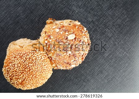 Sesame bread and whole grain bread represent the food and bakery concept related idea.
