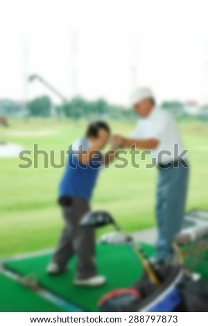 Blurry focus scene of golf course master trainer teaching action represent the golf sport course concept related idea.