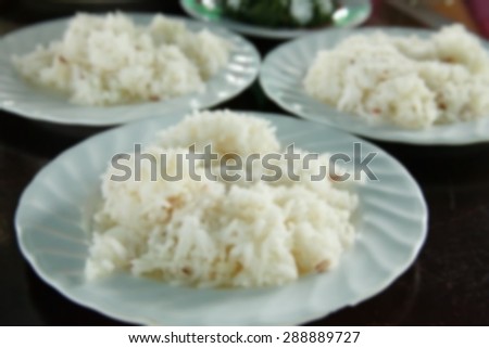 Blurry focus of rice on the food table scene represent the food background concept related idea.