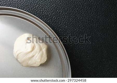 White powder for roti raw material put on the tinplate represent the Indian food background concept related idea.