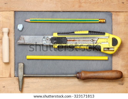 Stationery set and tools on slate board represent the stationery set concept related idea.