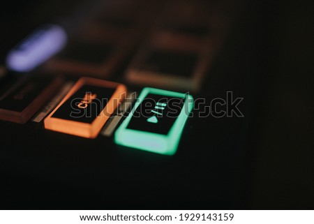 A closeup shot of the sound effect buttons with colorful lights in the darkness Сток-фото © 