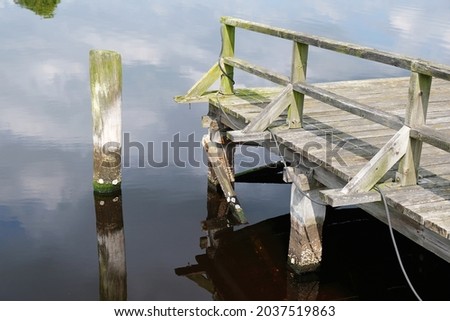 Similar – Foto Bild Bootssteg oder Badesteg aus schönem alten Holz im Sommer bei Sonnenschein am Alpsee in Schwangau bei Füssen im Allgäu im Freistaat Bayern