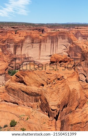 A large boulder is in the foreground, and a cliff is in the background, at Canyon de Chelle, Arizona Photo stock © 