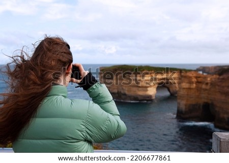 Similar – Image, Stock Photo Woman photographing rocky formations on smartphone