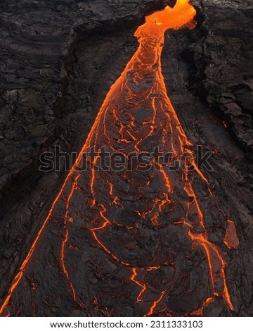 Similar – Image, Stock Photo Bright orange lava emitting out of volcano at night