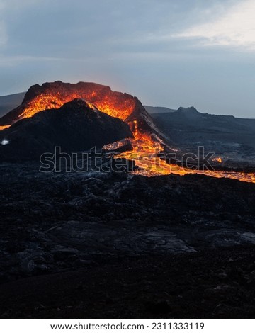 Similar – Image, Stock Photo Bright orange lava emitting out of volcano at night