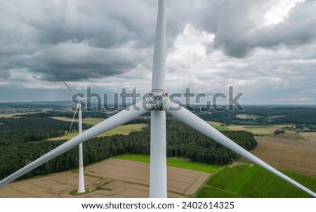 Similar – Image, Stock Photo View on several windmills, wind generators, turbines, producing renewable clean energy by converting kinetic energy