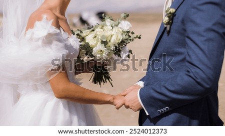 Similar – Image, Stock Photo Happy newlywed couple standing against waving sea