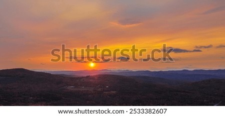 Similar – Image, Stock Photo Scenic sunset over peaceful sea and hilly shores