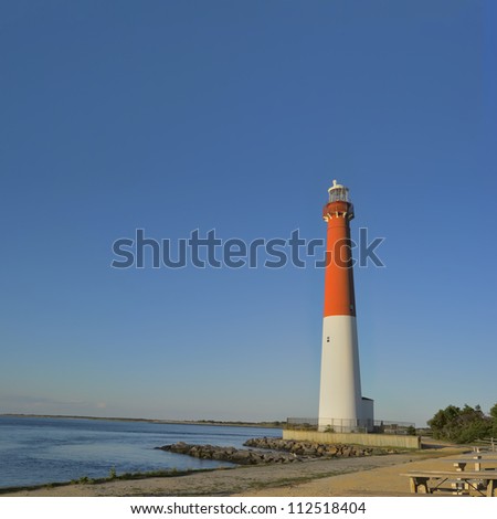 Barnegat Lighthouse located in Barnegat Lighthouse State Park in the town of Barnegat Light, Long Beach Island, New Jersey. The 165 foot tall red and white tower marks the 40th parallel.