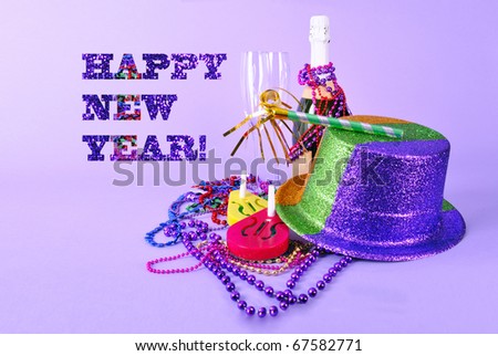 Happy New Year card - still life with champagne bottle and flutes, noisemakers, top hat, beads and text saying 
