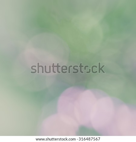 Green and pink pastel grunge abstract background with faded circles of light nature spring springtime eco-friendly colors