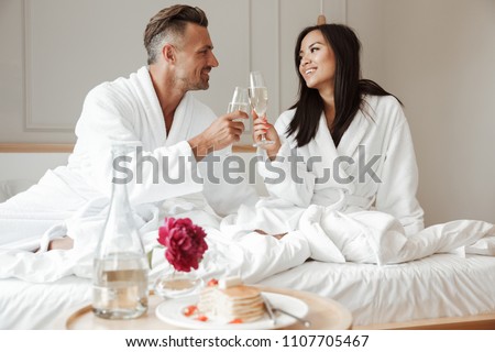 Similar – Image, Stock Photo Loving multiethnic couple resting together