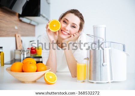 Similar – Image, Stock Photo Woman showing half orange over bowl