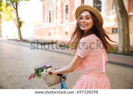 Similar – Image, Stock Photo Girl riding on bicycle in narrow street