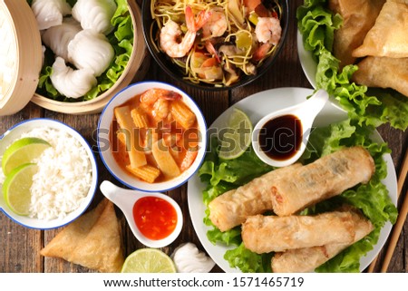 assorted of asian food with spring roll, soup, shrimp, rice